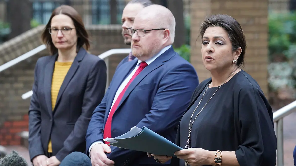 Detective Chief Inspector Iain Moor from the Bedfordshire, Cambridge and Hertfordshire major crime unit, 2nd right) and Jaswant Narwal Chief Crown Prosecutor, CPS Thames and Chiltern, right, speaking to the media outside Southwark Crown Court, in London, Monday Jan. 16, 2023, after serving Metropolitan Police officer David Carrick has admitted 49 offences, including 24 counts of rape, after carrying out sex attacks on a dozen women over an 18-year period. He pleaded guilty at Southwark Crown Court to four counts of rape, false imprisonment, and indecent assault, relating to a 40-year-old woman in 2003. In December at the Old Bailey, Carrick, who had served in the Army before joining the Met in 2001, admitted 43 charges against 11 other women, including 20 counts of rape, between March 2004 and September 2020. (Jonathan Brady/PA via AP)