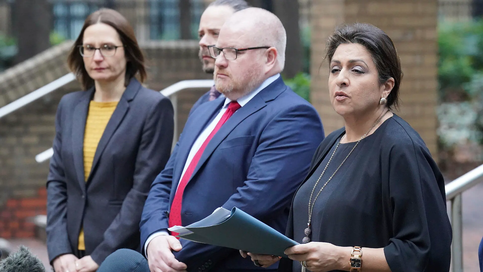 Detective Chief Inspector Iain Moor from the Bedfordshire, Cambridge and Hertfordshire major crime unit, 2nd right) and Jaswant Narwal Chief Crown Prosecutor, CPS Thames and Chiltern, right, speaking to the media outside Southwark Crown Court, in London, Monday Jan. 16, 2023, after serving Metropolitan Police officer David Carrick has admitted 49 offences, including 24 counts of rape, after carrying out sex attacks on a dozen women over an 18-year period. He pleaded guilty at Southwark Crown Court to four counts of rape, false imprisonment, and indecent assault, relating to a 40-year-old woman in 2003. In December at the Old Bailey, Carrick, who had served in the Army before joining the Met in 2001, admitted 43 charges against 11 other women, including 20 counts of rape, between March 2004 and September 2020. (Jonathan Brady/PA via AP)