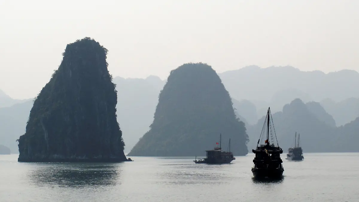 FILE PHOTO: File photo of tourist boats cruising in Halong Bay