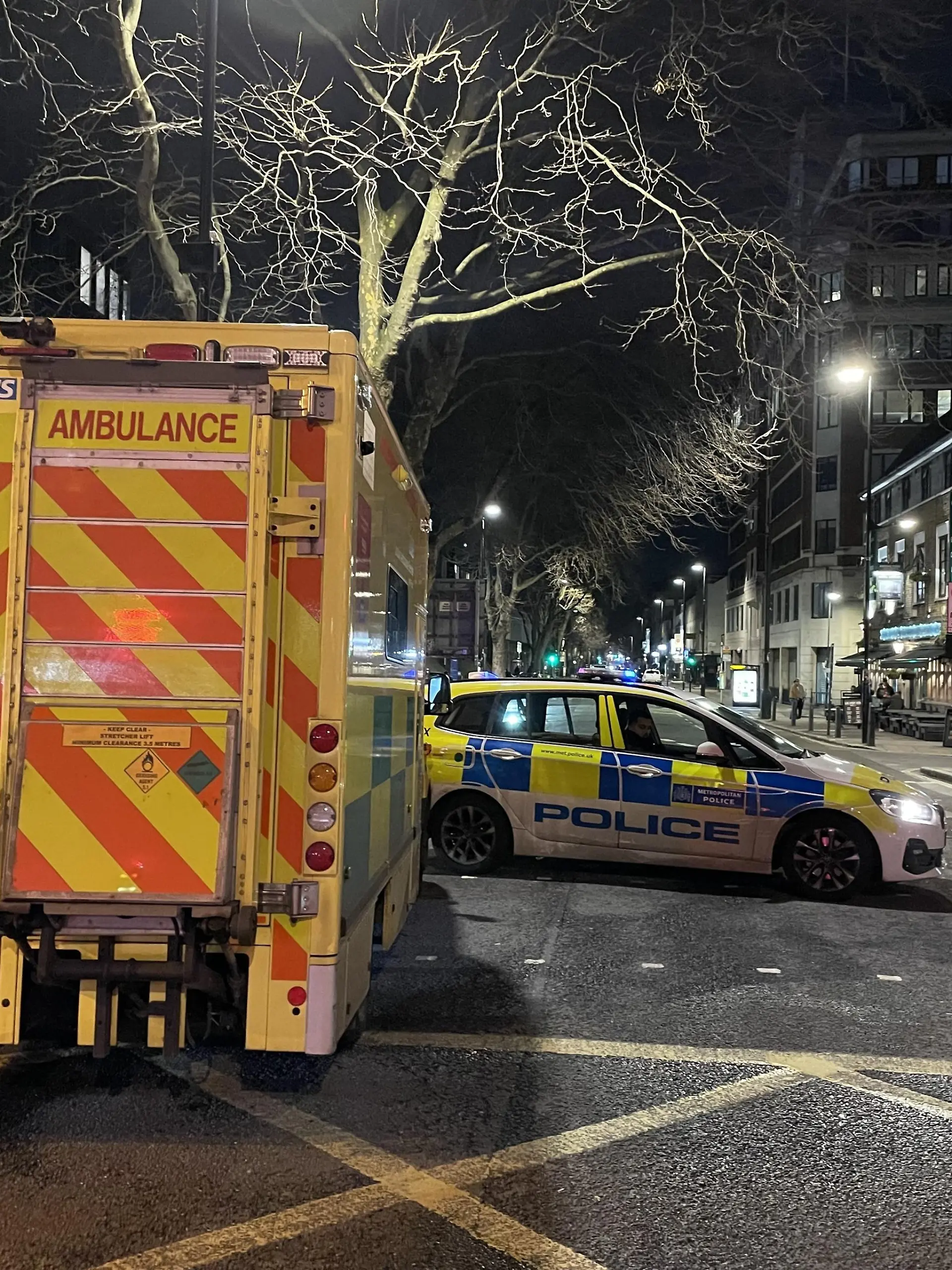 LONDON, UK - JANUARY 14: Police take measures after five people, including two children between the ages of 7 and 12, were injured Saturday after shots were fired from a moving vehicle in central London, United Kingdom on January 14, 2023. Roads near the scene are still closed to traffic as of 9 p.m. There is also increased police presence with an ambulance in the area. Burak Bir / Anadolu Agency