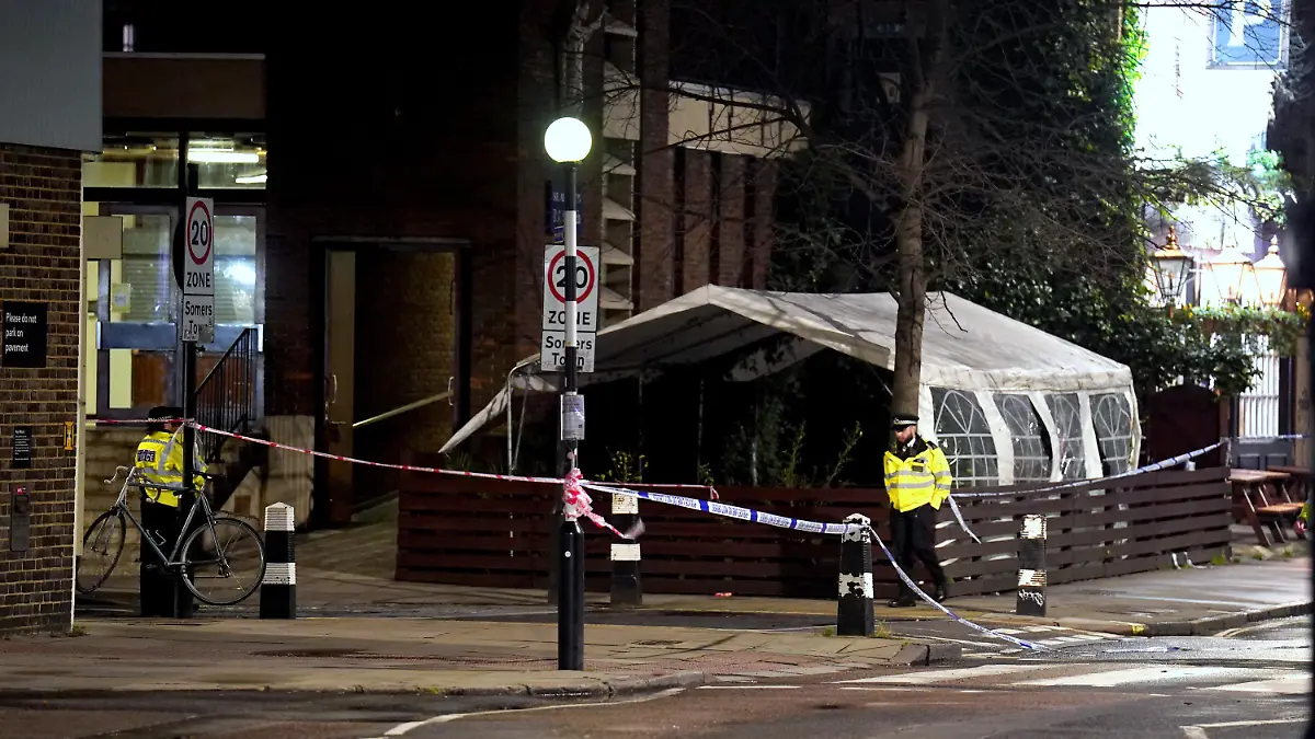 Drive-by shooting - Euston. Police near to the scene of a suspected drive-by shooting in Phoenix Road, next to Euston station in north London, where three women, aged 48, 54 and 41 along with a seven-year-old girl have been injured near a church where a funeral was taking place. Picture date: Saturday January 14, 2023. Their injuries have been assessed as non-life threatening, though the 48-year-old may have life-changing injuries. A seven-year-old girl was also taken to hospital and is believed to have been injured in the same incident. Officers said their initial inquiries suggest the shots came from a moving vehicle, which was then driven away from the scene. See PA story POLICE Funeral. Photo credit should read: James Manning/PA Wire URN:70563616