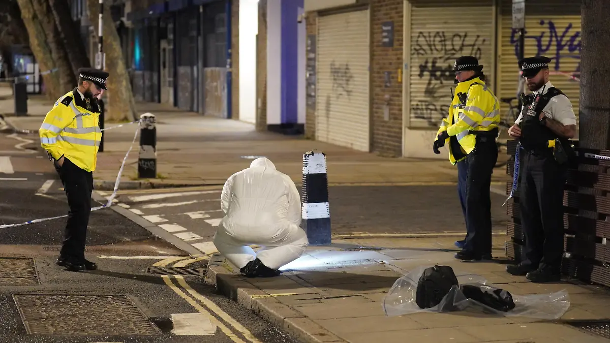 Drive-by shooting - Euston. A police forensics officer works near to the scene of a suspected drive-by shooting in Phoenix Road, next to Euston station in north London, where three women, aged 48, 54 and 41 along with a seven-year-old girl have been injured near a church where a funeral was taking place. Picture date: Saturday January 14, 2023. Their injuries have been assessed as non-life threatening, though the 48-year-old may have life-changing injuries. A seven-year-old girl was also taken to hospital and is believed to have been injured in the same incident. Officers said their initial inquiries suggest the shots came from a moving vehicle, which was then driven away from the scene. See PA story POLICE Funeral. Photo credit should read: James Manning/PA Wire URN:70564582