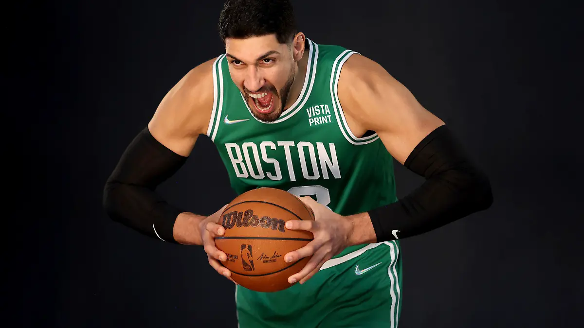 Boston Celtics center Enes Kanter yells for a photo during the Boston Celtics Media Day, Monday, Sept. 27, 2021, in Canton, Mass. (AP Photo/Mary Schwalm)