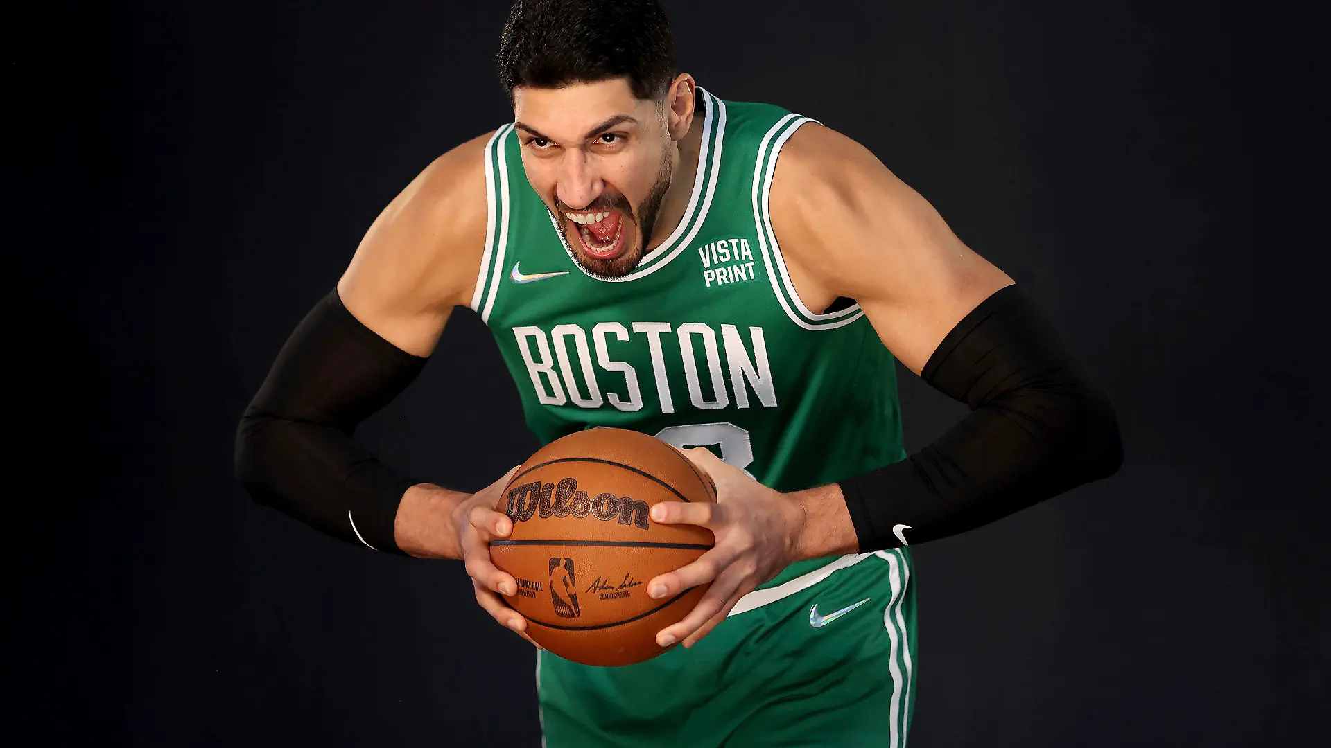 Boston Celtics center Enes Kanter yells for a photo during the Boston Celtics Media Day, Monday, Sept. 27, 2021, in Canton, Mass. (AP Photo/Mary Schwalm)
