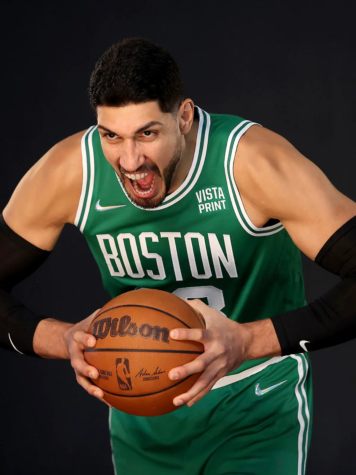 Boston Celtics center Enes Kanter yells for a photo during the Boston Celtics Media Day, Monday, Sept. 27, 2021, in Canton, Mass. (AP Photo/Mary Schwalm)