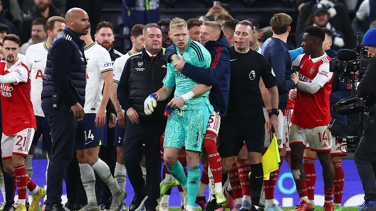 January 15, 2023, London: London, England, 15th January 2023. Aaron Ramsdale of Arsenal is led away after a fan tried to engage with him during the Premier League match at the Tottenham Hotspur Stadium, London. Photo via Newscom picture alliance