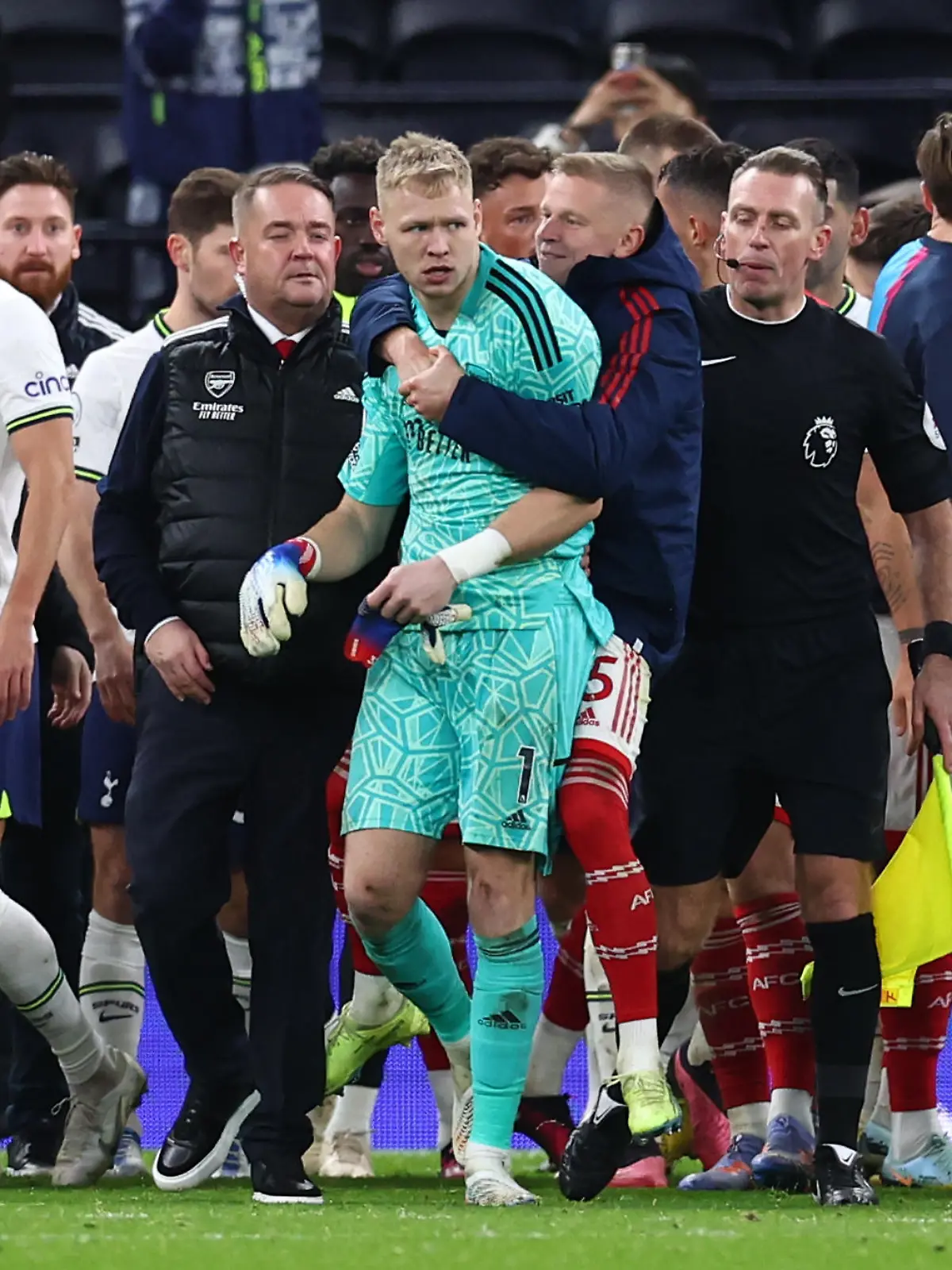 January 15, 2023, London: London, England, 15th January 2023. Aaron Ramsdale of Arsenal is led away after a fan tried to engage with him during the Premier League match at the Tottenham Hotspur Stadium, London. Photo via Newscom picture alliance