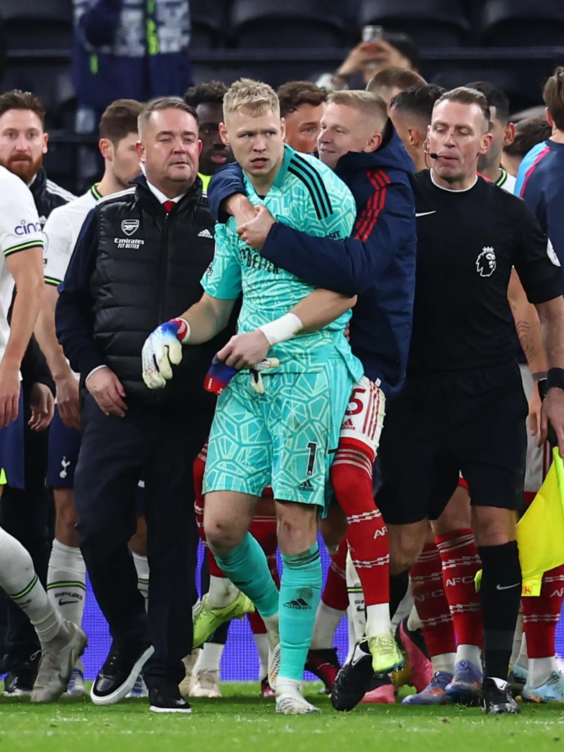 January 15, 2023, London: London, England, 15th January 2023. Aaron Ramsdale of Arsenal is led away after a fan tried to engage with him during the Premier League match at the Tottenham Hotspur Stadium, London. Photo via Newscom picture alliance