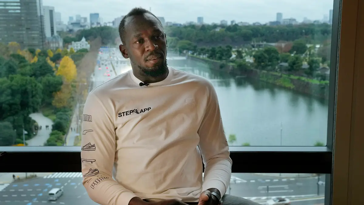 Usain Bolt, a retired Jamaican sprinter, speaks during an interview in Tokyo, Thursday, Dec. 1, 2022. Bolt, the world record holder in the 100 meters, 200 meters and an eight-time Olympic champion, was in Tokyo to help launch a fitness app called Step App which rewards users for increased levels of walking and running. (AP Photo/Hiro Komae)