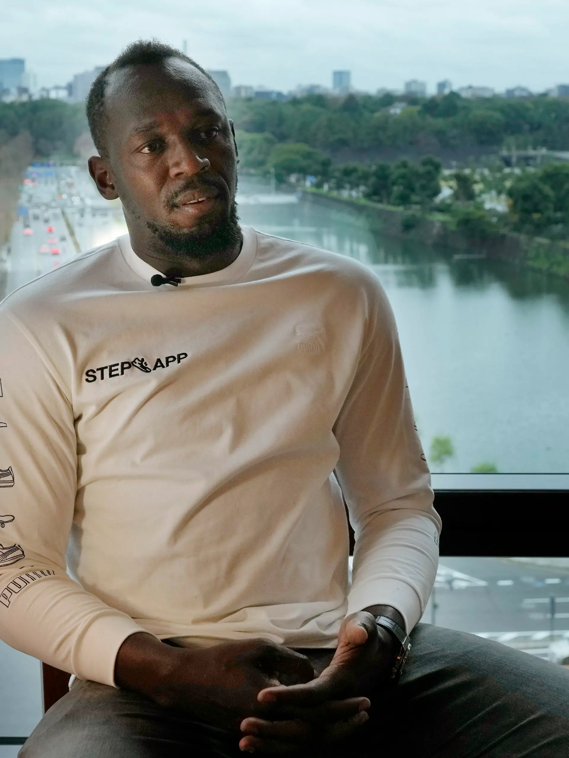 Usain Bolt, a retired Jamaican sprinter, speaks during an interview in Tokyo, Thursday, Dec. 1, 2022. Bolt, the world record holder in the 100 meters, 200 meters and an eight-time Olympic champion, was in Tokyo to help launch a fitness app called Step App which rewards users for increased levels of walking and running. (AP Photo/Hiro Komae)