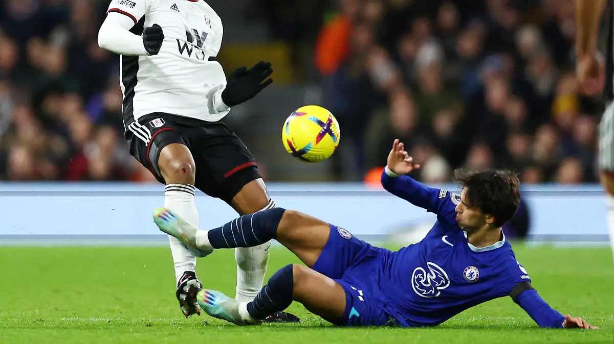 Soccer Football - Premier League - Fulham v Chelsea - Craven Cottage, London, Britain - January 12, 2023 Chelsea's Joao Felix fouls Fulham's Kenny Tete REUTERS/David Klein EDITORIAL USE ONLY. No use with unauthorized audio, video, data, fixture lists, club/league logos or 'live' services. Online in-match use limited to 75 images, no video emulation. No use in betting, games or single club /league/player publications.  Please contact your account representative for further details.     TPX IMAGES OF THE DAY