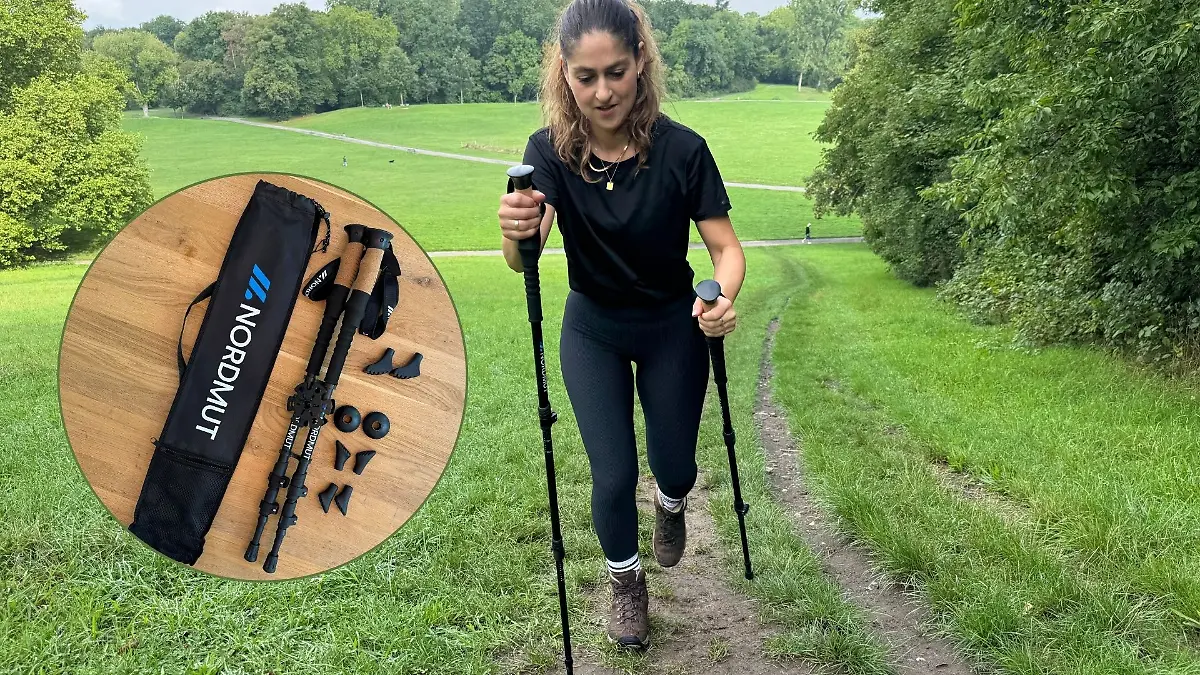 Redakteurin mit Wanderstöcken unterwegs.