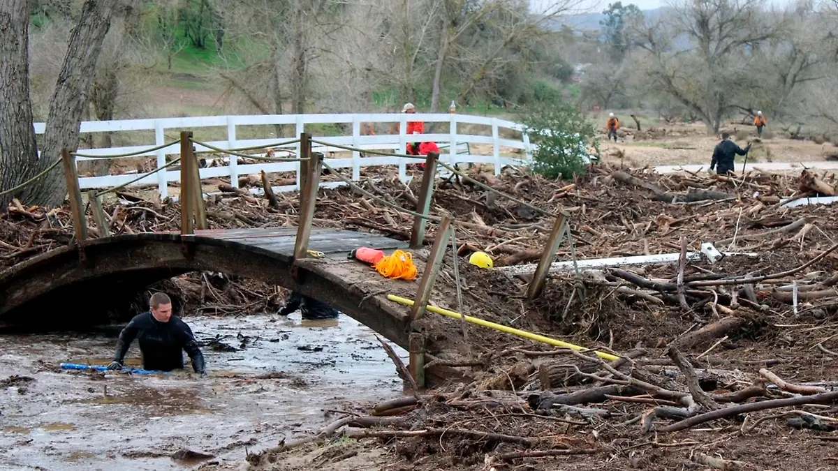 In this photo provided by San Luis Obispo County Sheriff's Office, rescuers resume their search on Wednesday, Jan. 11, 2023, for 5-year-old Kyle Doan, who was swept away Monday, Jan. 9, by floodwaters near San Miguel, Calif. (San Luis Obispo County Sheriff's Office via AP)