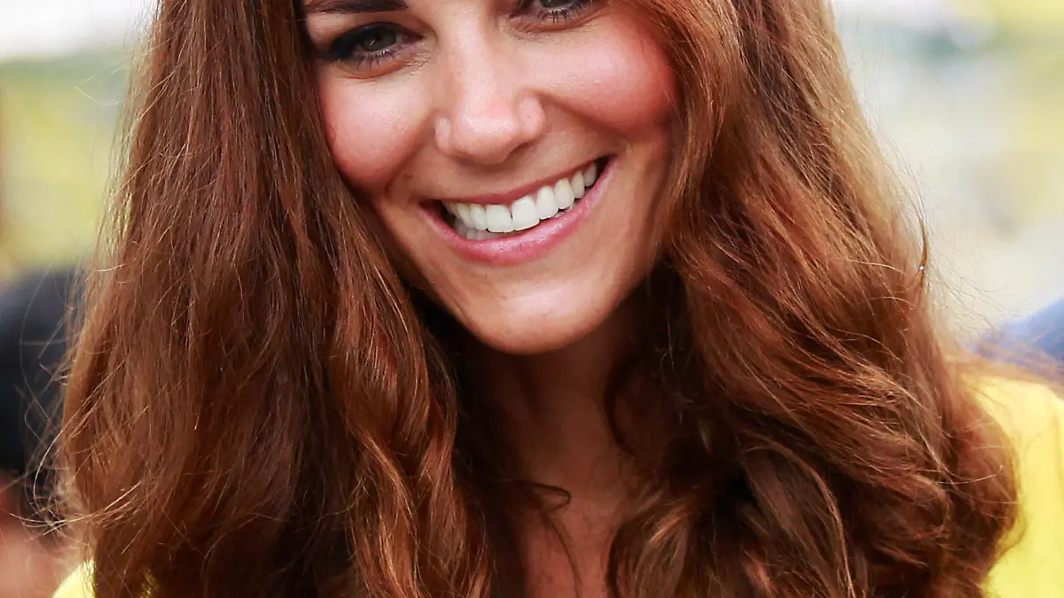 Britain's Catherine, the Duchess of Cambridge, smiles at the renovated Commonwealth Street in central Honiara on September 17, 2012. Britain's Prince William and wife Catherine are on a nine-day tour marking Queen Elizabeth II's Diamond Jubilee, and have already visited Singapore and Malaysia before arriving in the Solomon Islands.          AFP PHOTO / Daniel Munoz / POOL        (Photo credit should read DANIEL MUNOZ/AFP/GettyImages)