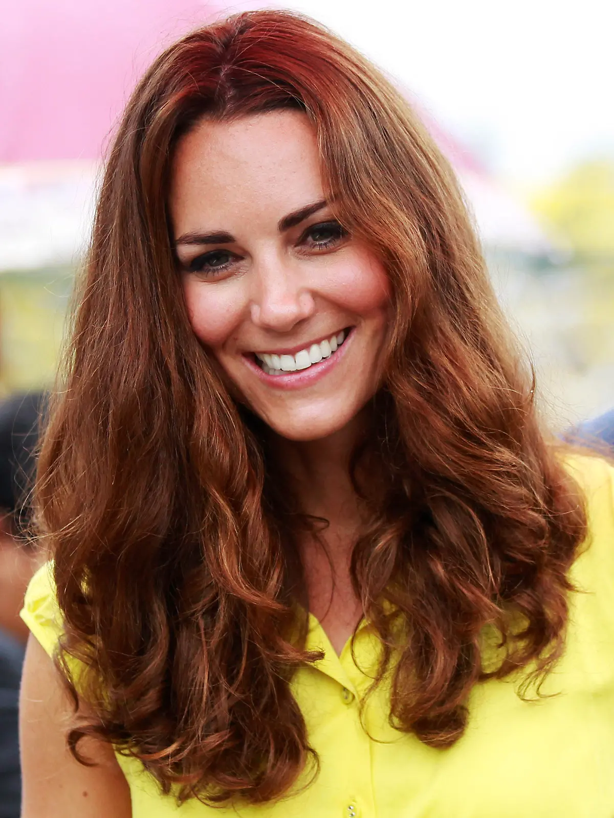 Britain's Catherine, the Duchess of Cambridge, smiles at the renovated Commonwealth Street in central Honiara on September 17, 2012. Britain's Prince William and wife Catherine are on a nine-day tour marking Queen Elizabeth II's Diamond Jubilee, and have already visited Singapore and Malaysia before arriving in the Solomon Islands.          AFP PHOTO / Daniel Munoz / POOL        (Photo credit should read DANIEL MUNOZ/AFP/GettyImages)