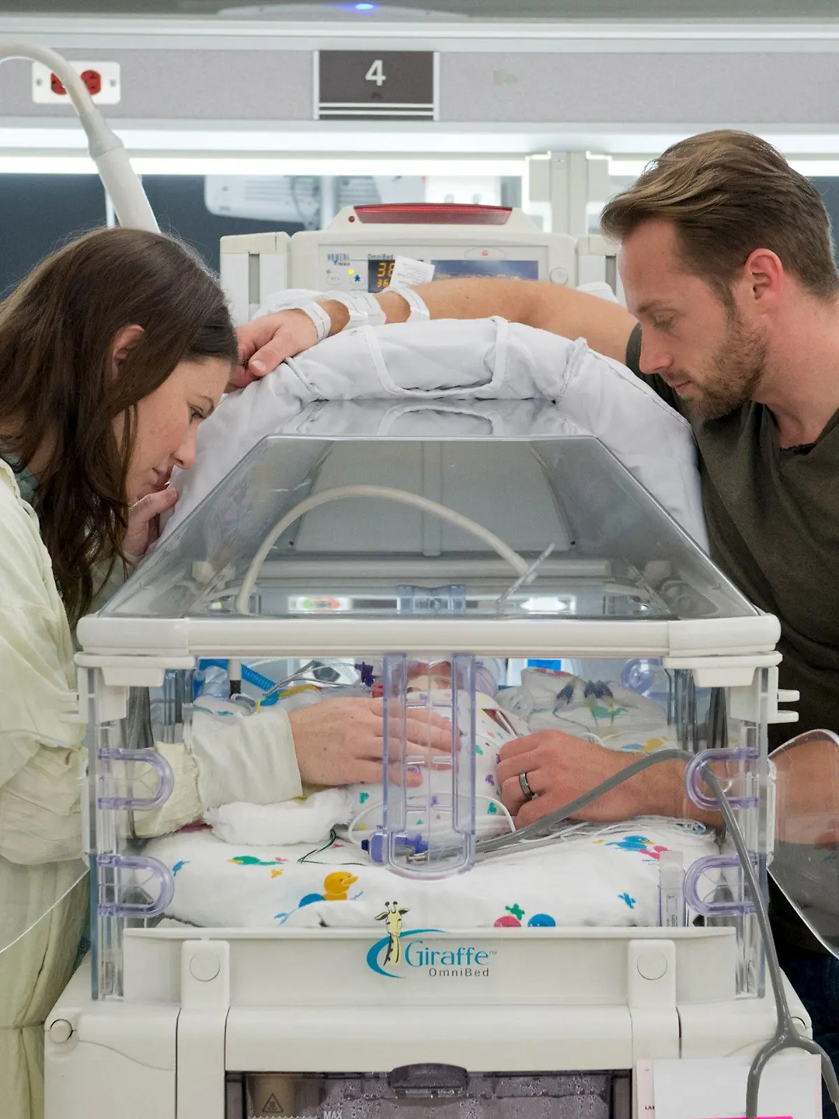 Danielle (L) and Adam Busby stand with one of their babies in an incubator in The Women's Hospital of Texas in Houston, in this undated handout photo. Danielle Busby gave birth to five girls in four minutes by cesarean section last week and all are doing well, a Texas hospital said. The hospital said the Busby girls are the first all-female quintuplets documented in the United States.  REUTERS/The Women's Hospital of Texas/Handout via ReutersATTENTION EDITORS - THIS PICTURE WAS PROVIDED BY A THIRD PARTY. REUTERS IS UNABLE TO INDEPENDENTLY VERIFY THE AUTHENTICITY, CONTENT, LOCATION OR DATE OF THIS IMAGE. FOR EDITORIAL USE ONLY. NOT FOR SALE FOR MARKETING OR ADVERTISING CAMPAIGNS. THIS PICTURE IS DISTRIBUTED EXACTLY AS RECEIVED BY REUTERS, AS A SERVICE TO CLIENTS. NO SALES. NO ARCHIVES. NO COMMERCIAL USE.â€¨      TPX IMAGES OF THE DAY     