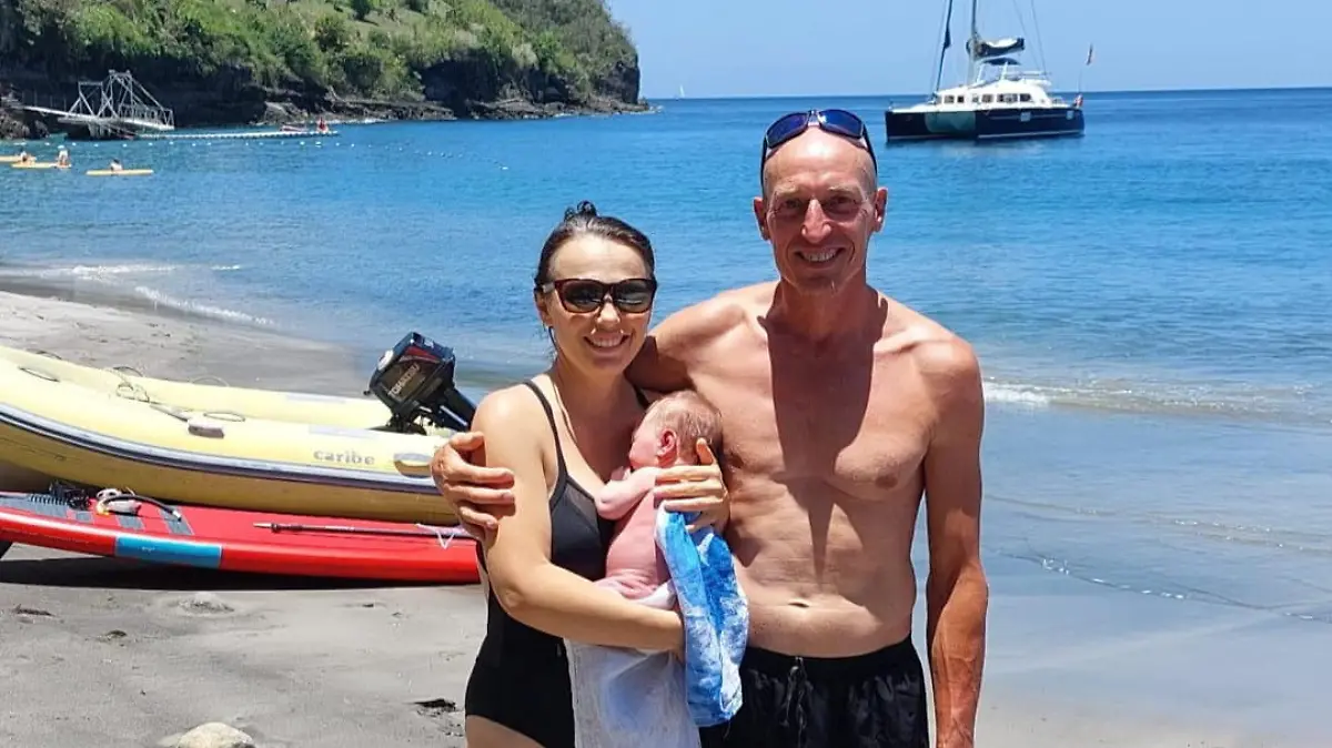 SONDERKONDITIONEN: Satzpreis!
Clive, Iuliia and their daughter Louisa. See SWNS story SWSMstranded. A British mum-to-be who flew 4,000 across the world to give birth on a beach is now "stranded" off the coast of Grenada with her four month old. Iuliia Gurzhii, 38, and her husband, Clive, 51, say they "feel like prisoners" after getting stuck in Grenada - unable to register her newborn's birth or apply for a passport. The couple left Tameside, Manchester, to the Caribbean island of Martinique in March 2023 when Iuliia was 35 weeks pregnant and hoped to have a natural birth on the beach - leaving their daughter Elizabeth, eight, in the UK as they couldn't get her passport renewed. After a week in Martinique, the couple moved on to a boat off the coast of St Lucia to give birth to their baby girl.  / action press