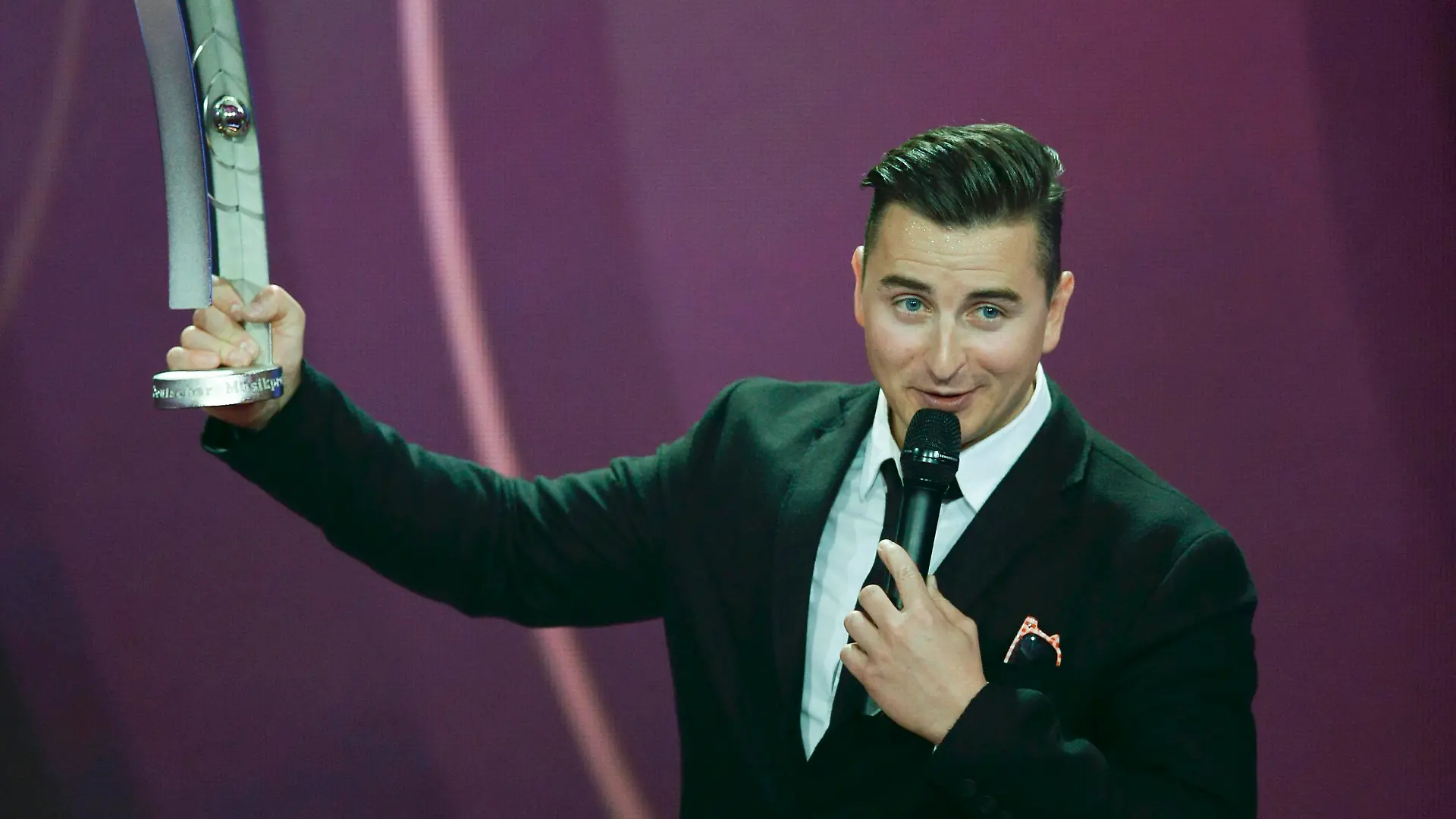 Singer Andreas Gabalier receives the award as Most Successful Volkstuemlicher (folklike) Musican during the 2015 Echo Music Awards in Berlin March 26, 2015. Established in 1992, the German Phonographic Academy honours national and international artists with the Echo German music prize. REUTERS/Michael Sohn/Pool