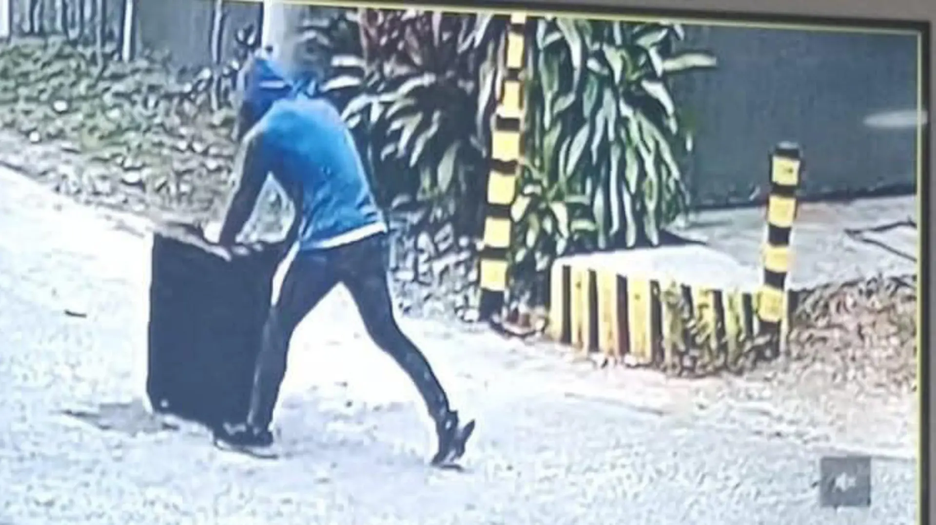 A schoolgirl has been rescued after she was abducted and stuffed in a suitcase by her family's apartment caretaker Godiflor Rama, 32, (PICTURED ON CCTV) in the Philippines.

Eight-year-old Jin Nichole You, who has dual Filipino and Korean nationality, was returning home when he was bundled into the case in the town of Bakilid in Mandaue City, Cebu province before noon on August 10.  PACKAGE: Video, pictures, text