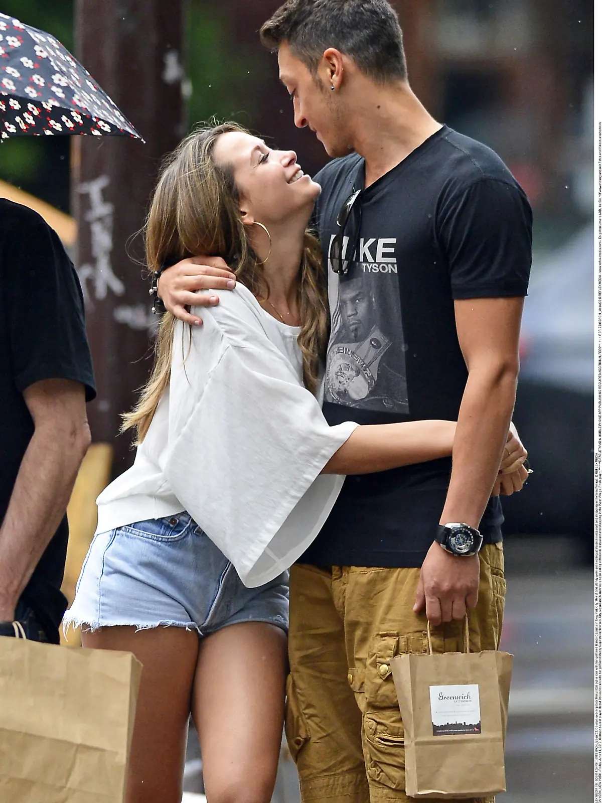 98868, NEW YORK, NEW YORK - Friday, June 14, 2013. German soccer player Mesut Ozil out in rain with her girlfriend Mandy Capristo in New York City. Mesut and Mandy were seen eating at Morandi restaurant and shopping in the West Village. Photograph:   **** **E-TABLET/IPAD & MOBILE PHONE APP PUBLISHING REQUIRES ADDITIONAL FEES** : + : + REF: 98868PCN_Mesut02 © REFLEX MEDIA  -  www.reflex-media.com  -  Es gelten unsere AGB, die Sie mit Verwendung unserer Fotos und Videos anerkennen.