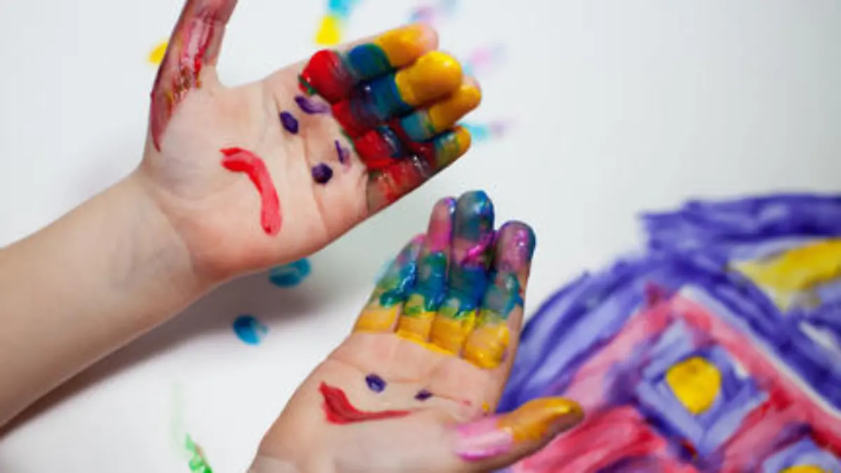 Little Children Hands doing Fingerpainting with various colors