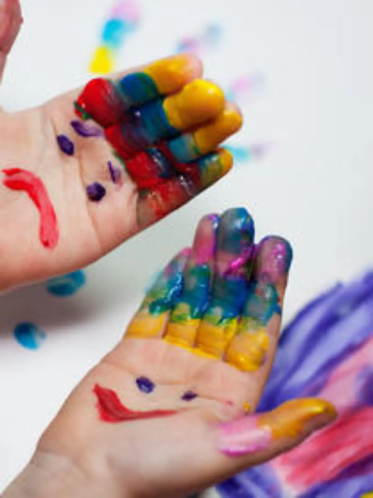 Little Children Hands doing Fingerpainting with various colors