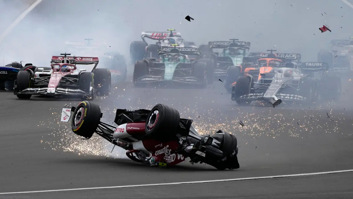 Alfa Romeo driver Guanyu Zhou of China crashes at the start of the British Formula One Grand Prix at the Silverstone circuit, in Silverstone, England, Sunday, July 3, 2022. (AP Photo/Frank Augstein)