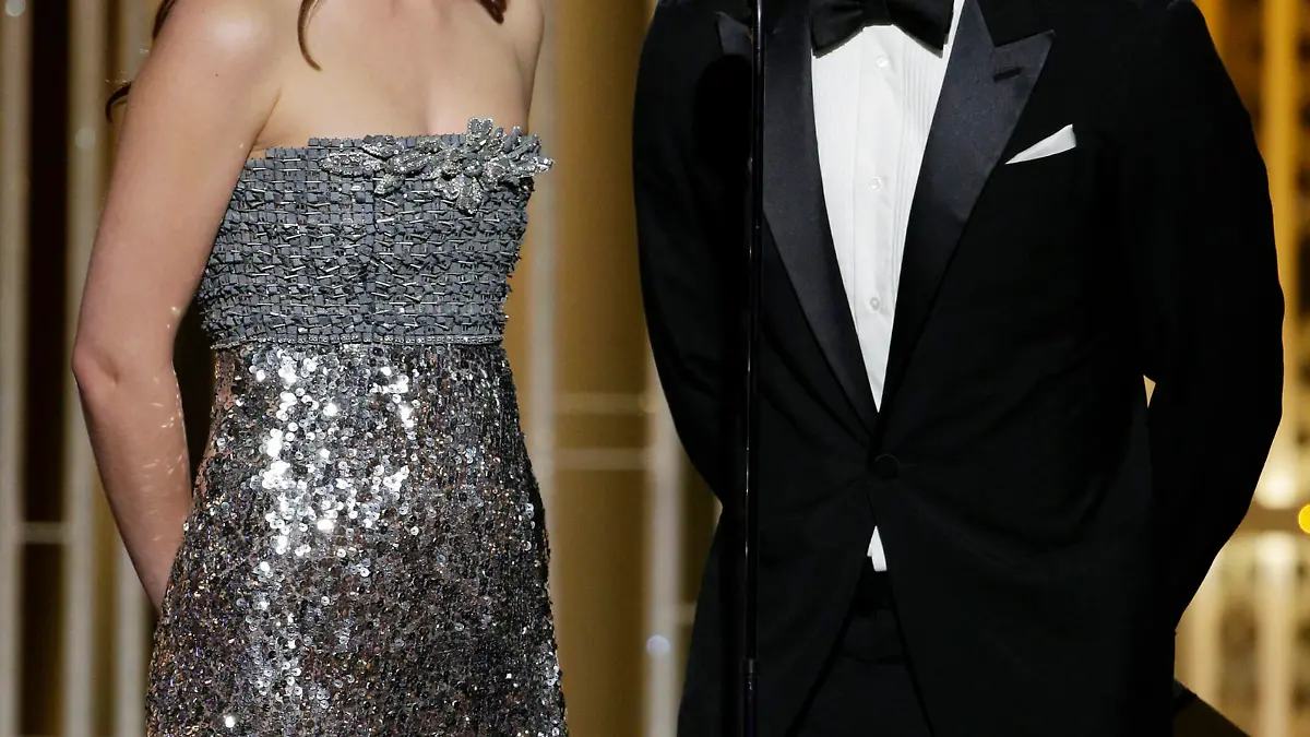 BEVERLY HILLS, CA - JANUARY 11: In this handout photo provided by NBCUniversal, Presenters Dakota Johnson and Jamie Dornan speak onstage during the 72nd Annual Golden Globe Awards at The Beverly Hilton Hotel on January 11, 2015 in Beverly Hills, California. (Photo by Paul Drinkwater/NBCUniversal via Getty Images)