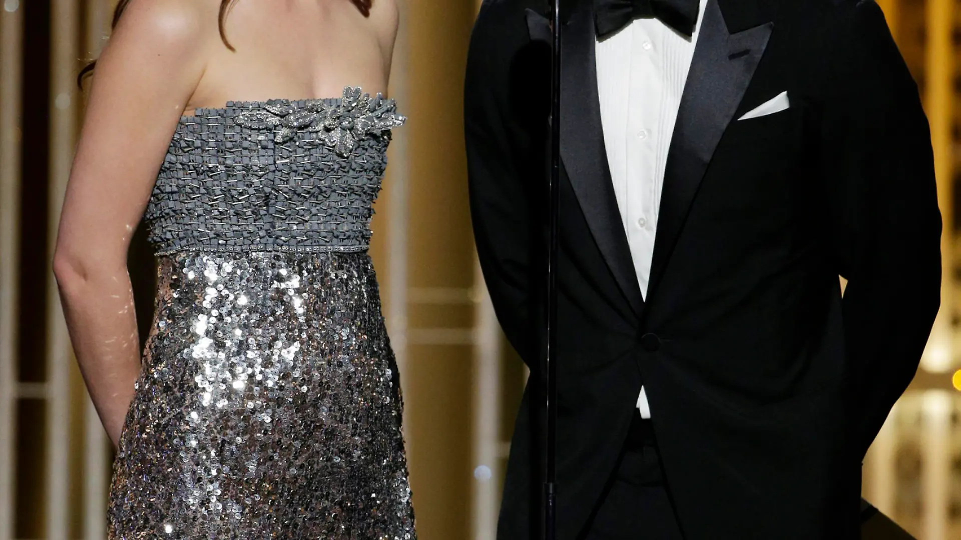 BEVERLY HILLS, CA - JANUARY 11:  In this handout photo provided by NBCUniversal, Presenters Dakota Johnson and Jamie Dornan speak onstage during the 72nd Annual Golden Globe Awards at The Beverly Hilton Hotel on January 11, 2015 in Beverly Hills, California.  (Photo by Paul Drinkwater/NBCUniversal via Getty Images)