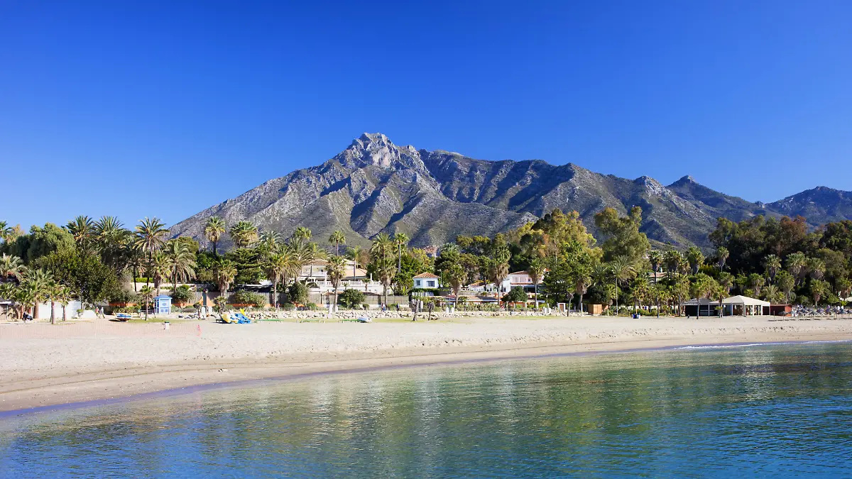 Marbella sandy beach, summer holiday scenery by the Mediterranean Sea in Spain, Andalusia region, Costa del Sol, Malaga province.