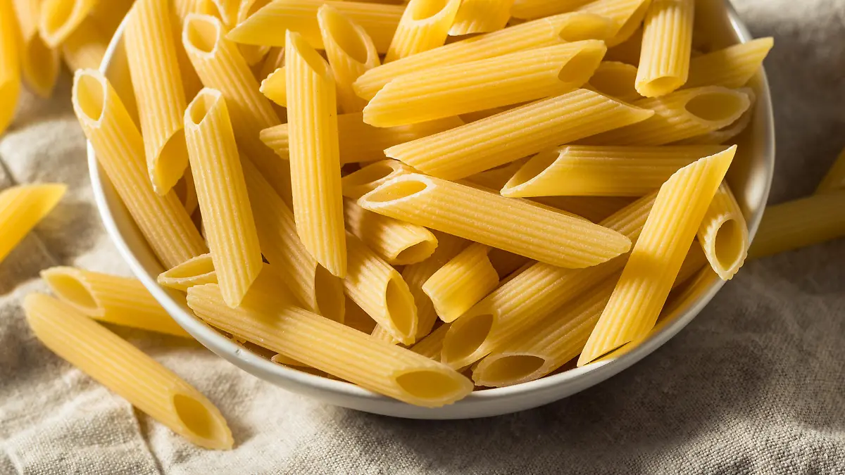 Homemade Raw Dry Penne Pasta in a Bowl