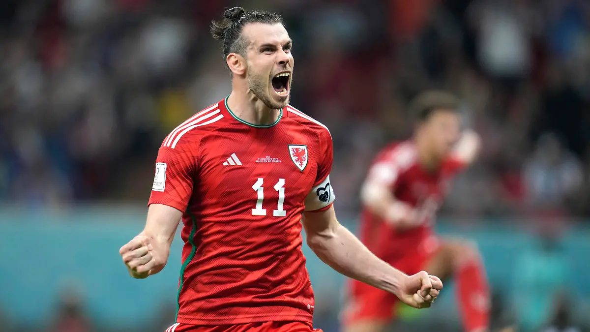 FILE - Wales' Gareth Bale celebrates after scoring his side's opening goal during the World Cup, group B soccer match between the United States and Wales, at the Ahmad Bin Ali Stadium in Doha, Qatar, Monday, Nov. 21, 2022. Gareth Bale is retiring from soccer at age 33 after setting a Wales record with 41 international goals. “My decision to retire from International football has been by far the hardest of my career,” Bale said in a statement Monday, Jan. 9, 2023.(AP Photo/Ashley Landis, File)