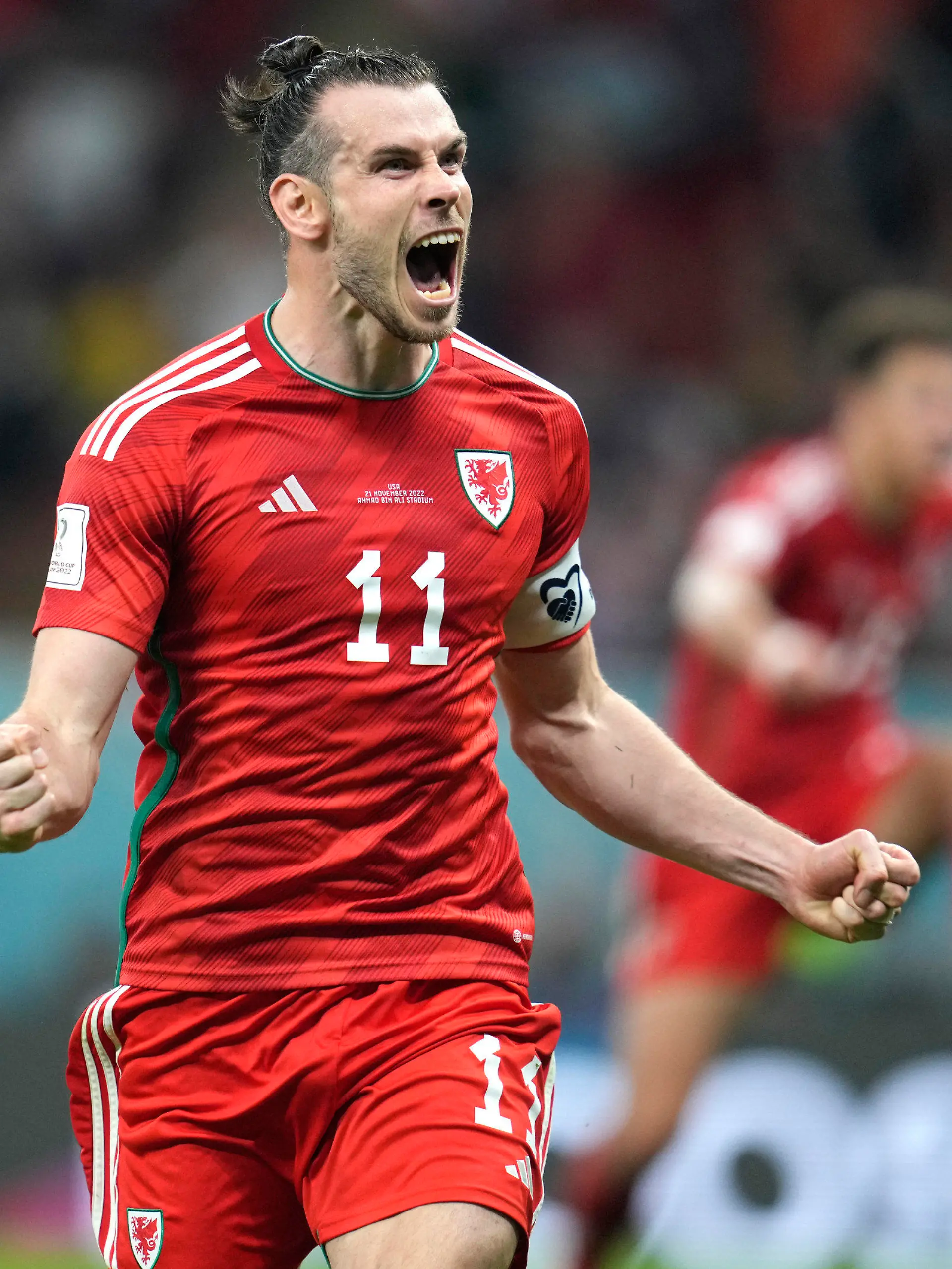 FILE - Wales' Gareth Bale celebrates after scoring his side's opening goal during the World Cup, group B soccer match between the United States and Wales, at the Ahmad Bin Ali Stadium in Doha, Qatar, Monday, Nov. 21, 2022. Gareth Bale is retiring from soccer at age 33 after setting a Wales record with 41 international goals. “My decision to retire from International football has been by far the hardest of my career,” Bale said in a statement Monday, Jan. 9, 2023.(AP Photo/Ashley Landis, File)
