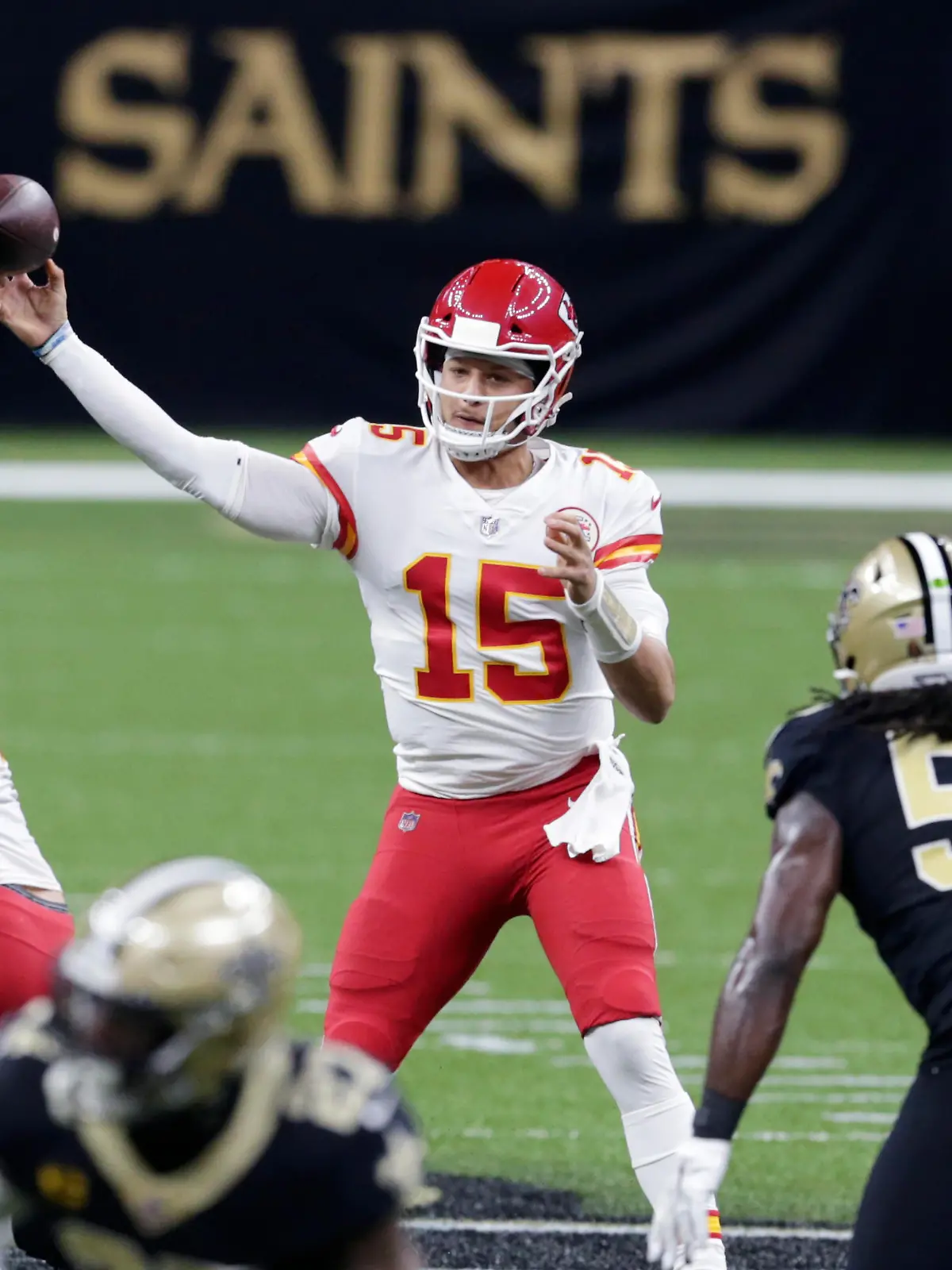 Kansas City Chiefs quarterback Patrick Mahomes (15) passes in the first half of an NFL football game against the New Orleans Saints in New Orleans, Sunday, Dec. 20, 2020. (AP Photo/Butch Dill)