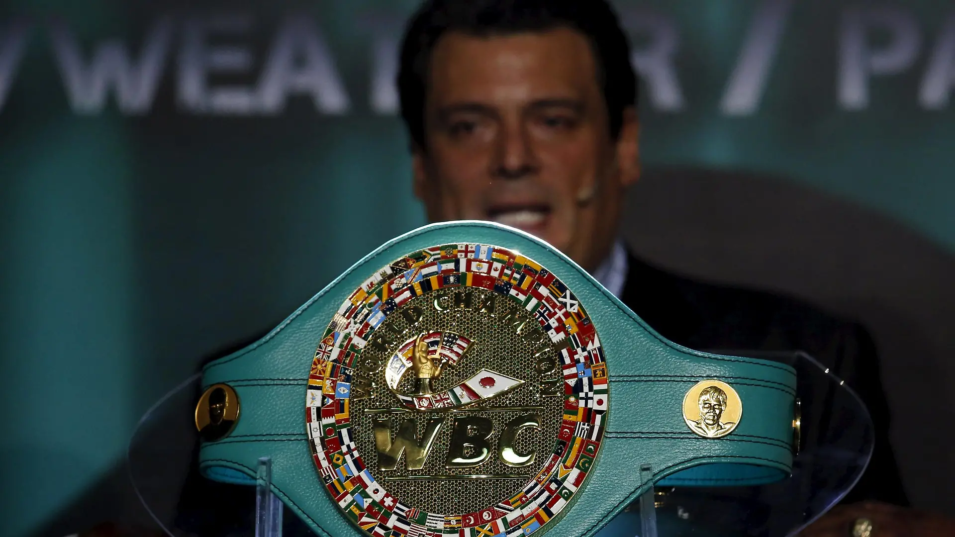 World Boxing Council President Mauricio Sulaiman presents the Mexican-made title belt in Mexico City April 21, 2015. The World Boxing Council (WBC) presented a gold and emerald encrusted title belt in Mexico City, ahead of the long awaited mega bout between Floyd Mayweather Jr. and Manny Pacquiao. The belt was made by 12 Mexican artisans and is encrusted with 3,015 emeralds and surrounded by 800 grams of pure gold. The buckle is surrounded by the flags of the 167 countries that take part in the council and the faces of late Jose Sulaiman, the honorary head of the World Boxing Council, and boxing legend Muhammad Ali, also adorn the belt.   REUTERS/Bernardo Montoya  