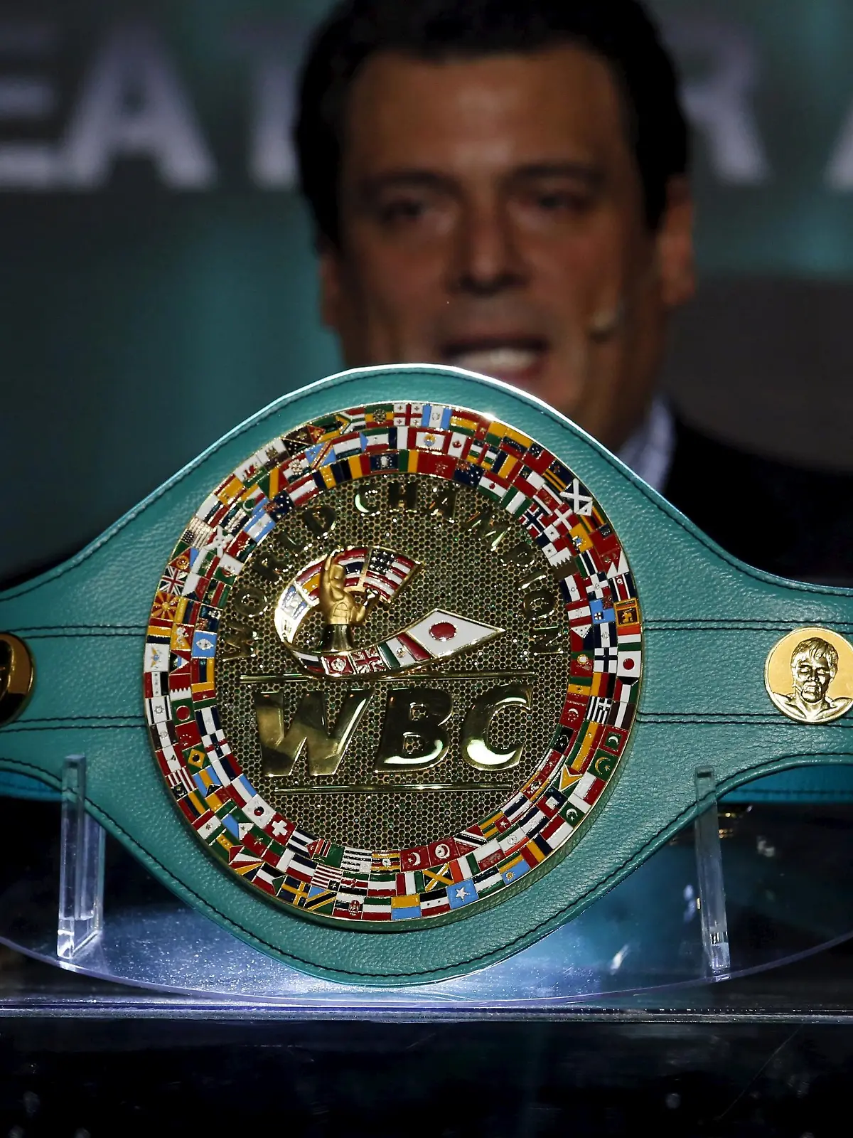 World Boxing Council President Mauricio Sulaiman presents the Mexican-made title belt in Mexico City April 21, 2015. The World Boxing Council (WBC) presented a gold and emerald encrusted title belt in Mexico City, ahead of the long awaited mega bout between Floyd Mayweather Jr. and Manny Pacquiao. The belt was made by 12 Mexican artisans and is encrusted with 3,015 emeralds and surrounded by 800 grams of pure gold. The buckle is surrounded by the flags of the 167 countries that take part in the council and the faces of late Jose Sulaiman, the honorary head of the World Boxing Council, and boxing legend Muhammad Ali, also adorn the belt.   REUTERS/Bernardo Montoya  