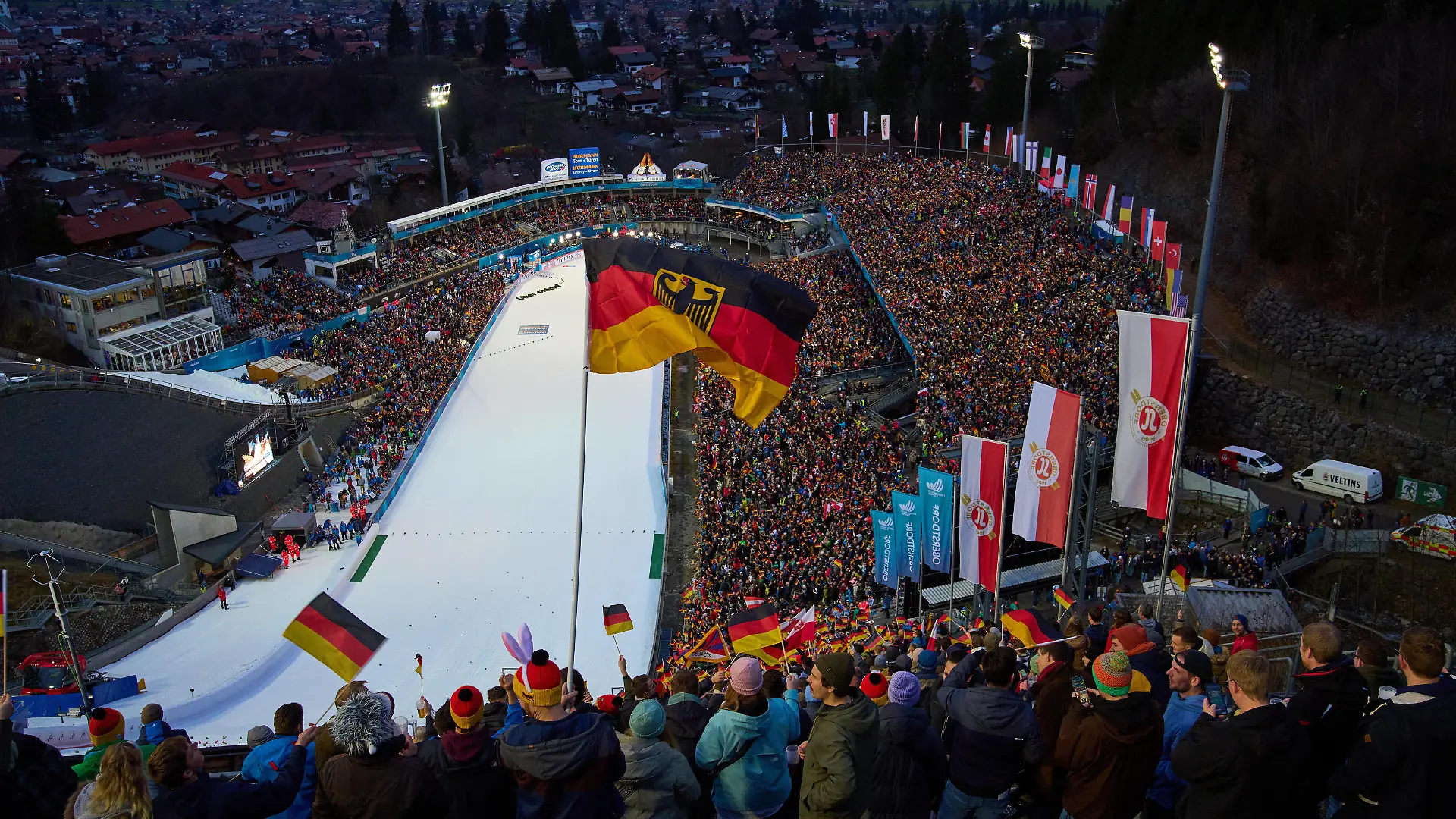 Fans with german national flags and David Kubacki, POL on the screen at the 71. Four Hills Tournament Ski jumping, Skispringen, Ski, nordisch at WM-Skisprung Arena Oberstdorf , Bavaria, Germany, Dec 29, 2022.