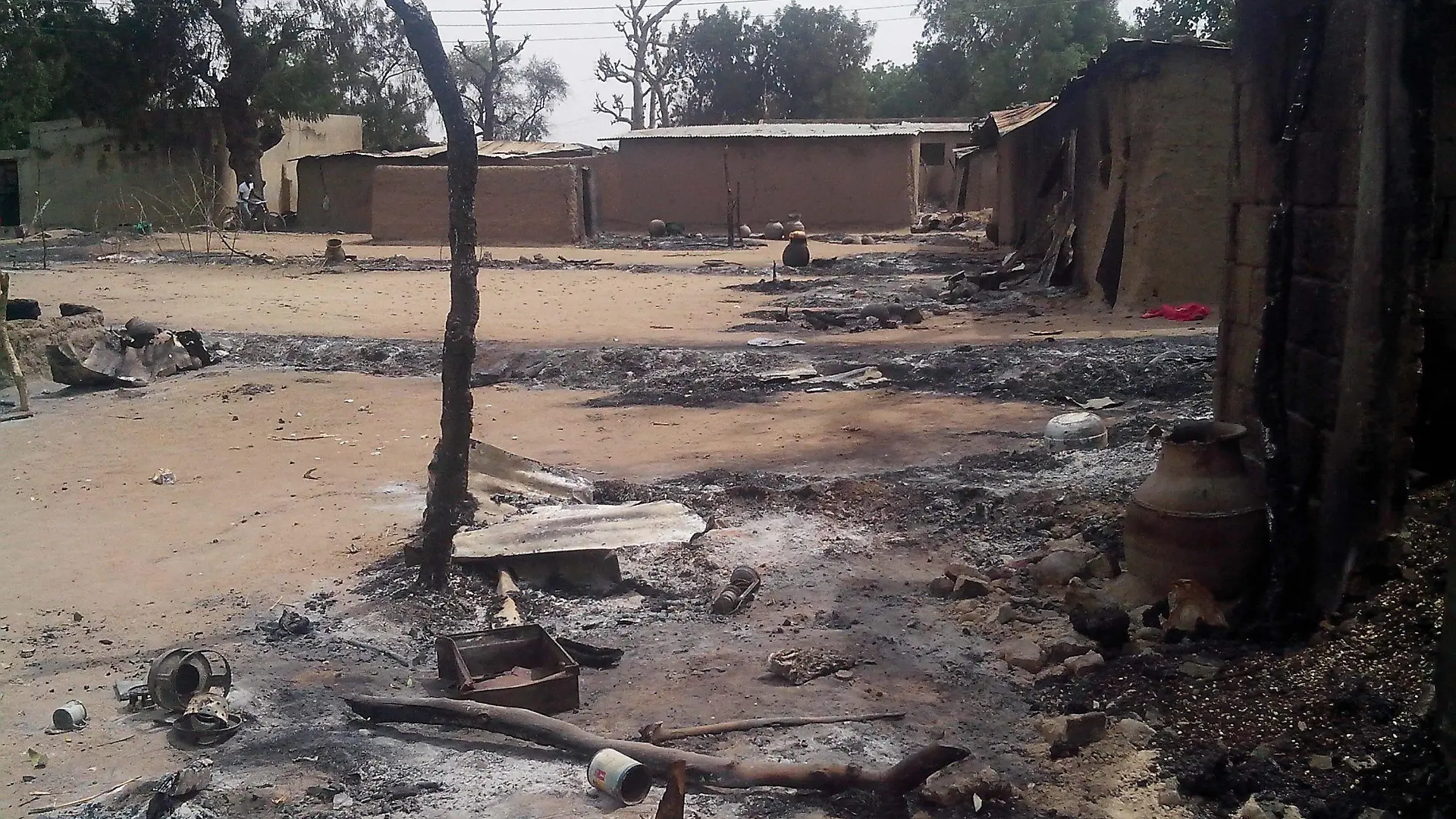epa04046539 A photograph made available on 29 January 2014 and dated 28 January 2013 shows the remains of a houses after a Boko Haram attack, killing 70 people, in Kawuri, Nigeria. Reports state that 200 house where also destroyed during the attacks. The Islamist group, Boko Haram, whose name means 'Western education is forbidden,' is active in north-eastern Nigeria. EPA/STR +++(c) dpa - Bildfunk+++