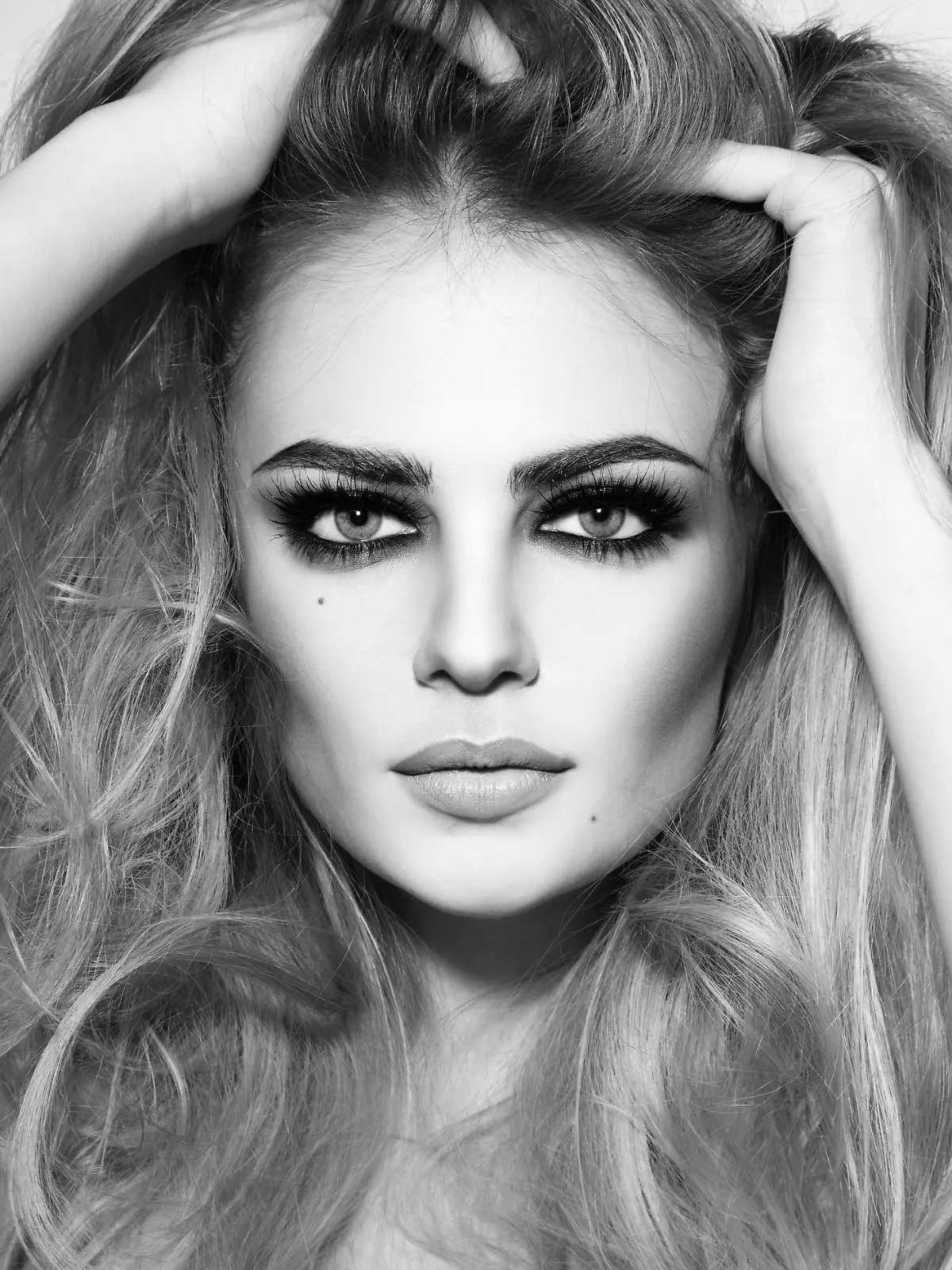 Black and white shot of young beautiful sexy girl with long hair and smoky eyes
