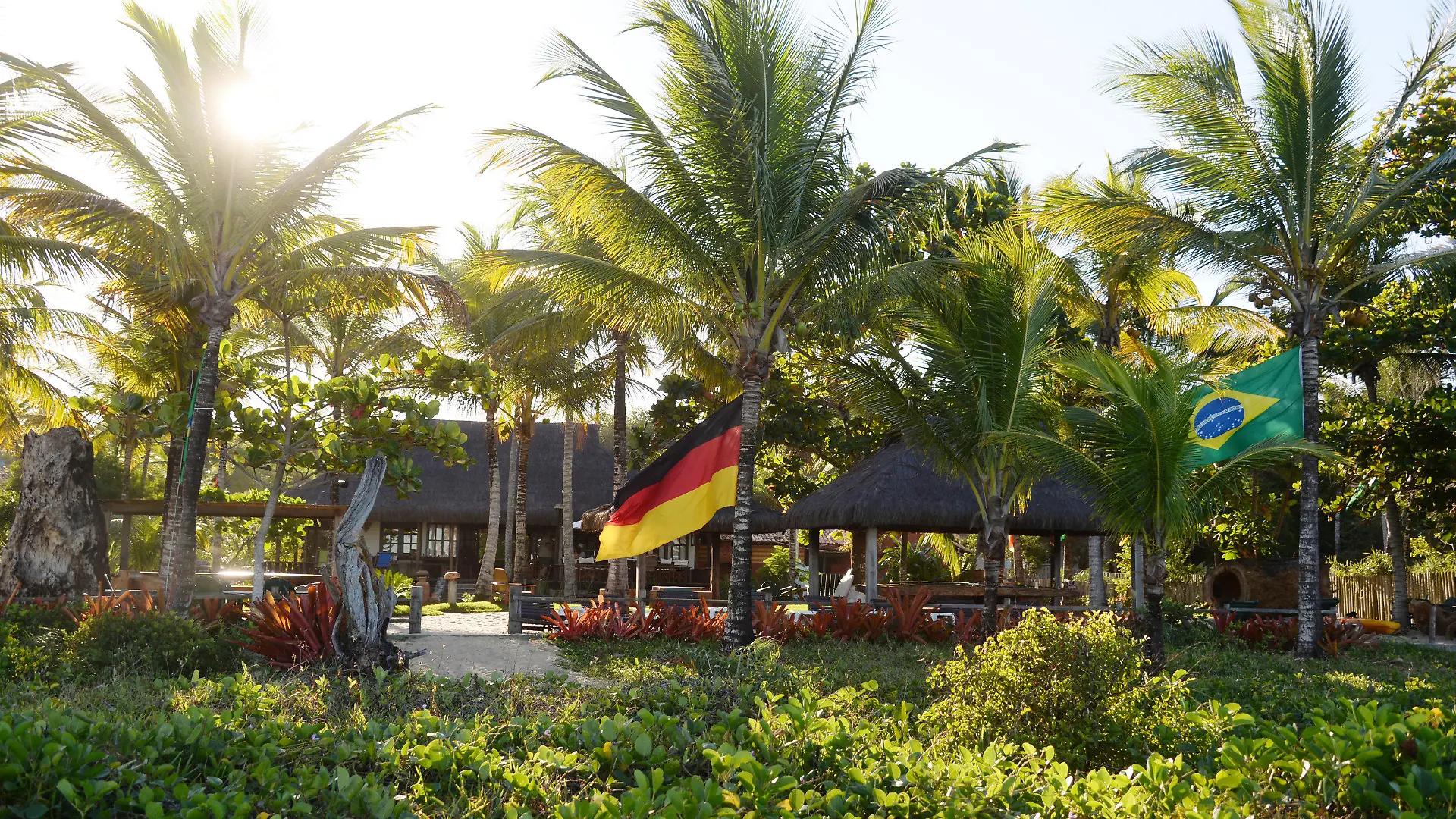 A German and a Brazilian flag fly near the German team base at the Campo Bahia resort in Santo Andre, Brazil, 07 June 2014. The FIFA World Cup will take place in Brazil from 12 June to 13 July 2014. Photo: Marcus Brandt/dpa +++(c) dpa - Bildfunk+++