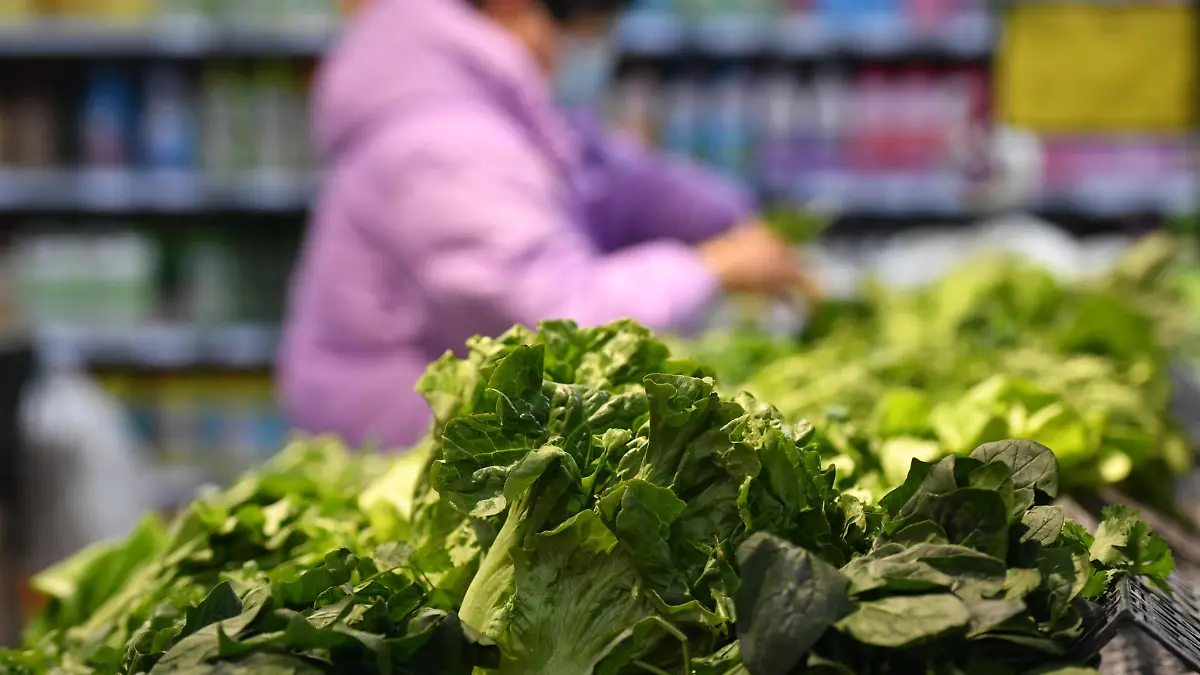 FUYANG, CHINA - DECEMBER 8, 2022 - A customer buys vegetables at a supermarket in Fuyang city, Anhui province, China, Dec 9, 2022. The consumer price index (CPI) rose 1.6 percent year on year in November, according to the National Bureau of Statistics.