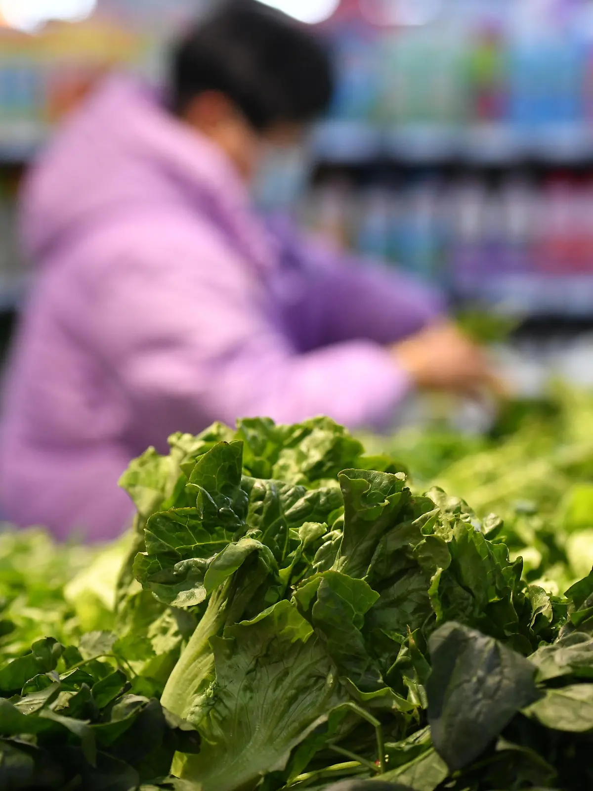 FUYANG, CHINA - DECEMBER 8, 2022 - A customer buys vegetables at a supermarket in Fuyang city, Anhui province, China, Dec 9, 2022. The consumer price index (CPI) rose 1.6 percent year on year in November, according to the National Bureau of Statistics.