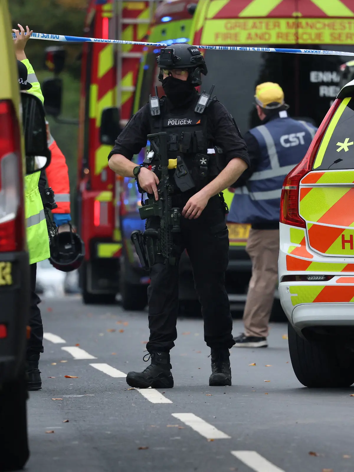 Emergency personnel work at the scene following an incident outside a synagogue, in Manchester