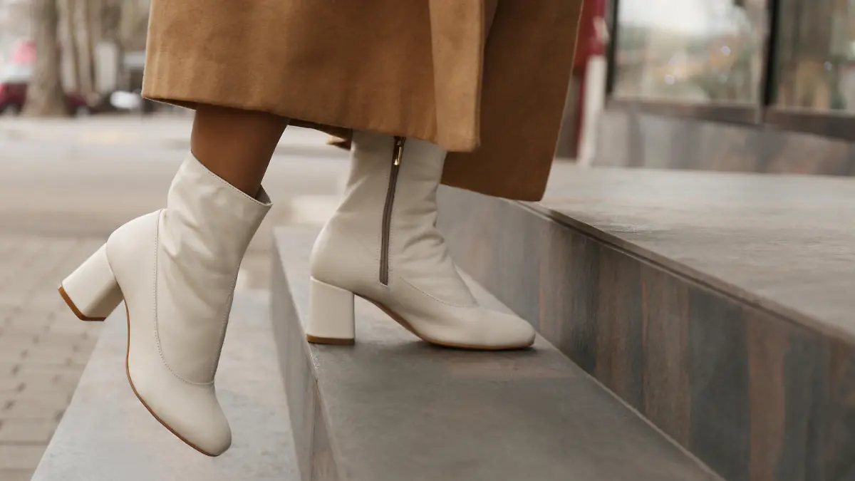 Woman wearing stylish leather shoes on stairs outdoors, closeup