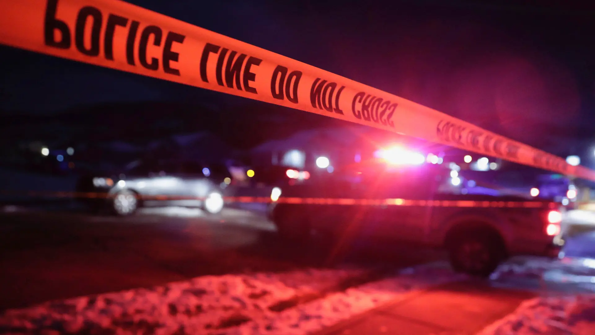 Police tape surrounds the crime scene in Enoch, Utah, where eight members of a family were found from gunshot wounds, Wednesday, Jan. 4, 2023. (Ben B. Braun/The Deseret News via AP)