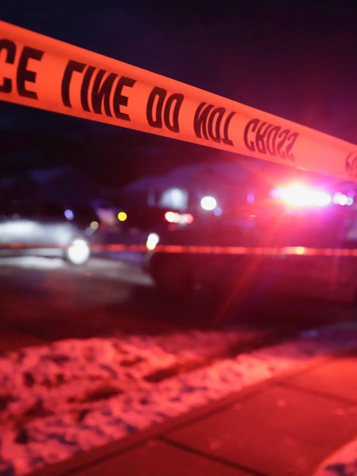 Police tape surrounds the crime scene in Enoch, Utah, where eight members of a family were found from gunshot wounds, Wednesday, Jan. 4, 2023. (Ben B. Braun/The Deseret News via AP)