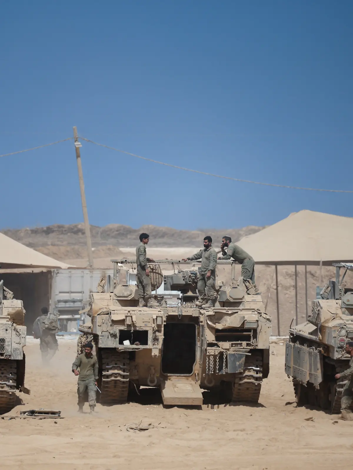 Israeli soldiers on top of an APC in Israel near border with Gaza
