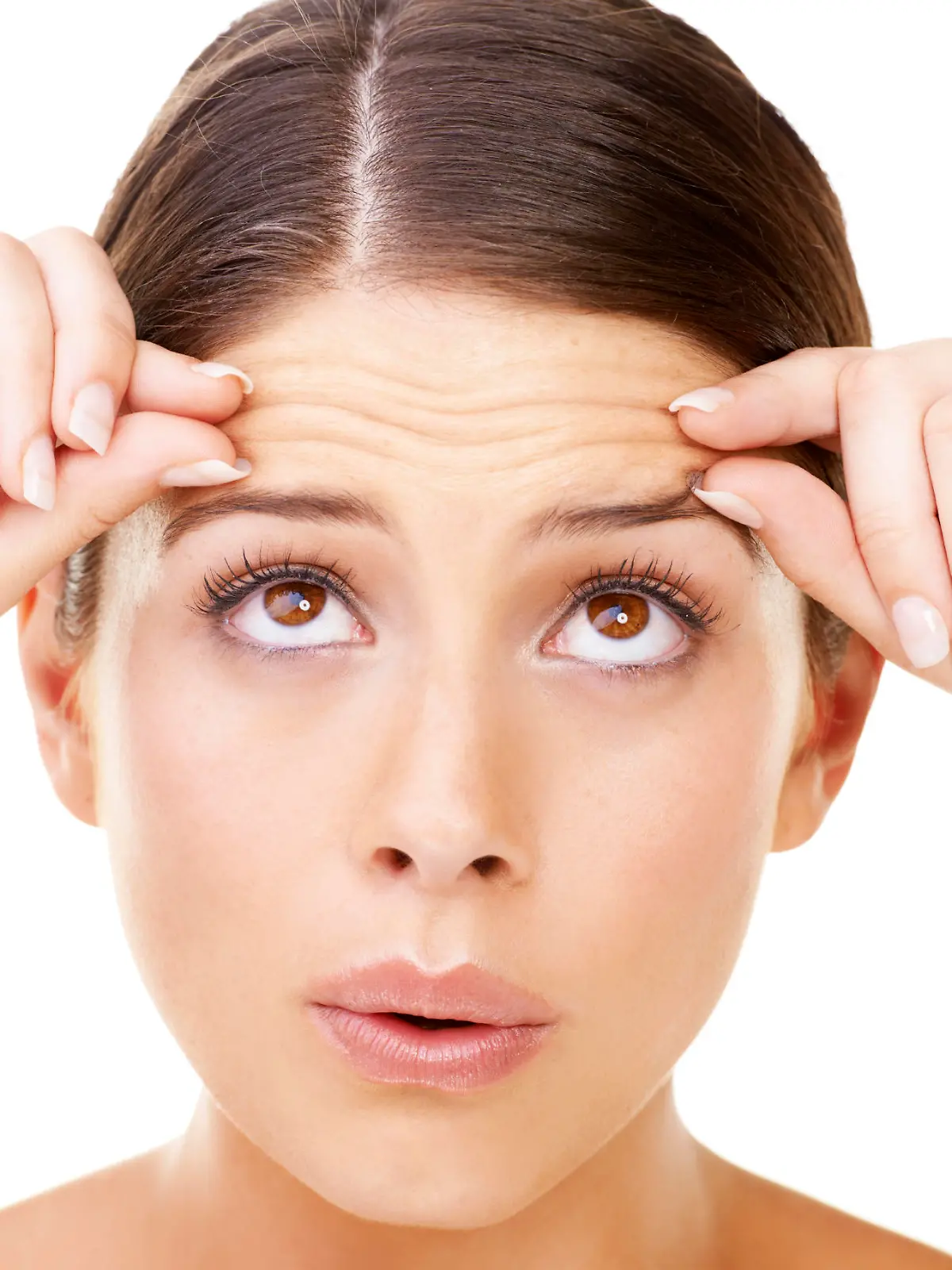 Young brunette pinching her forehead and looking upwards