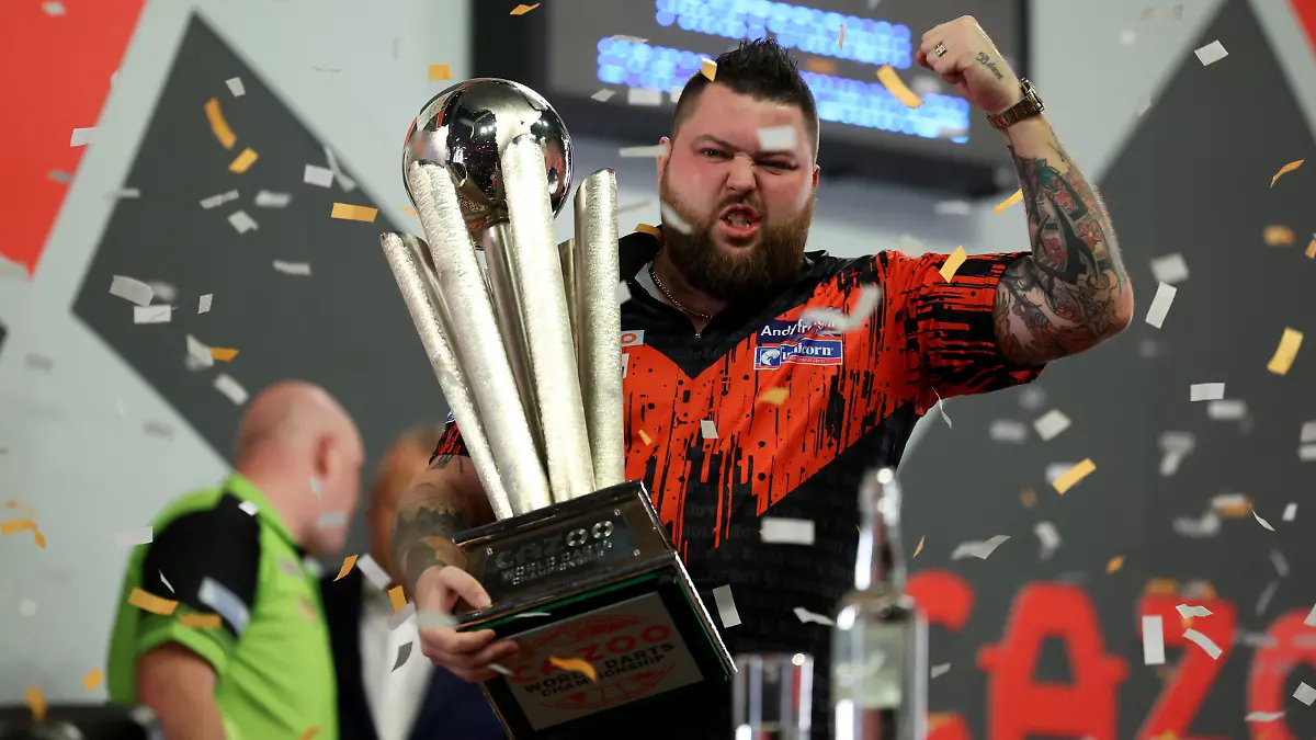 3rd January 2023, Alexandra Palace, London, England; 2022/23 PDC Cazoo World Darts Championships Day 16 Final; Michael Smith celebrates with the World Darts Championship trophy after beating Van Gerwen by a score of 7-4 / action press
