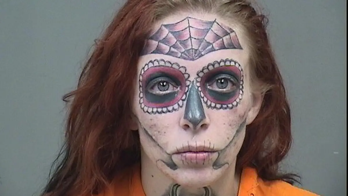 PIC FROM Kennedy News / Mahoing County Sheriff's Office (PICTURED: ALYSSA ZEBRASKY'S MUGSHOT SHOWING HER FACE TATTOOS) A woman whose mugshot went viral for her heavily tattooed FACE is undergoing gruelling laser treatment to blast the inking off - in a bid to forget the ex who she was arrested with. Alyssa Zebrasky, Cleveland, Ohio, US, underwent the elaborate Day of the Dead tatt four years ago, while in a toxic relationship with an ex-partner who also had elaborate face inkings. The 31-year-old got a spider web on her forehead as well as black shading around her eyes, nose, cheeks and lips in two arduous sessions in June 2018. DISCLAIMER: While Kennedy News and Media uses its best endeavours to establish the copyright and authenticity of all pictures supplied, it accepts no liability for any damage, loss or legal action caused by the use of images supplied and the publication of images is solely at your discretion. SEE KENNEDY NEWS COPY - 0161 697 4266